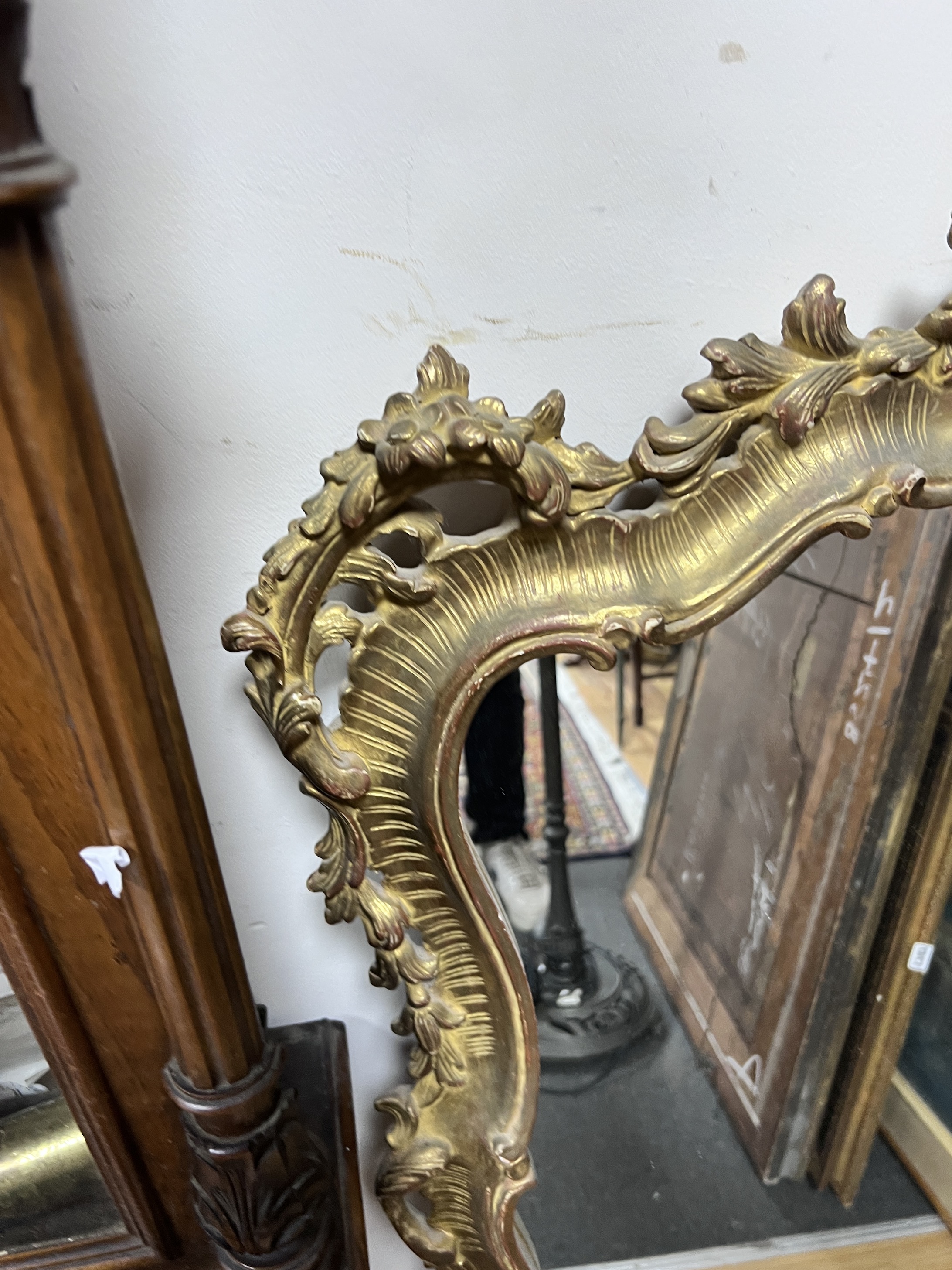 A Louis XVI style giltwood rococo framed wall mirror, height 116cm, width 84cm